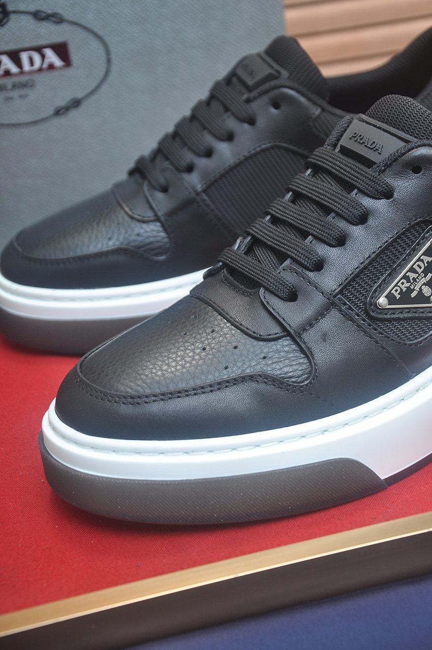 Prada Triangle Plaque Low-Top Sneakers — detail